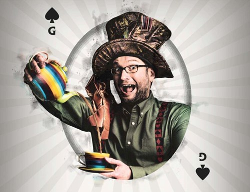 Comedian, Gary Delaney, looks amused wearing a big, bronze hat and pouring tea from a tea pot into a teacup. He looks to be coming out of a playing card that is the G of spades. 