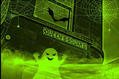 An image of the theatre has been edited with a Halloween theme. The image now includes a ghost, cobwebs and a bat along with an eerie green and black haze. 
